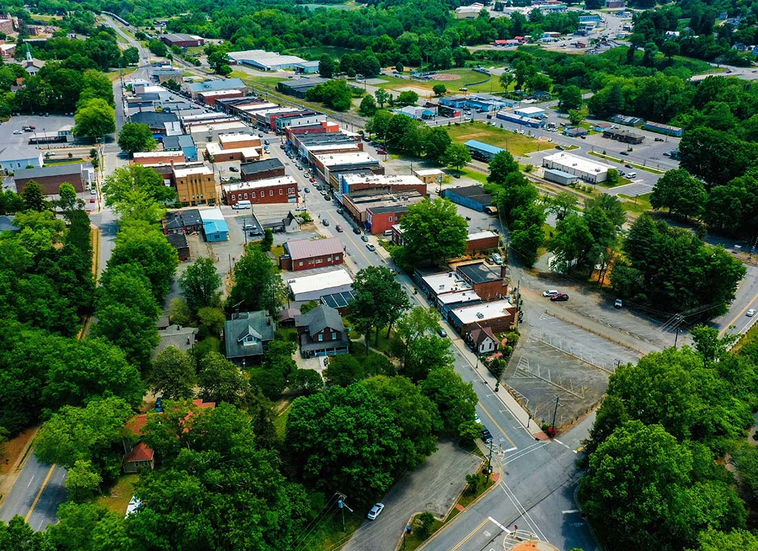 Kannapolis, NC - Aerial View of Buildings in the Small Town of Kannapolis North Carolina Surrounded by Green Trees